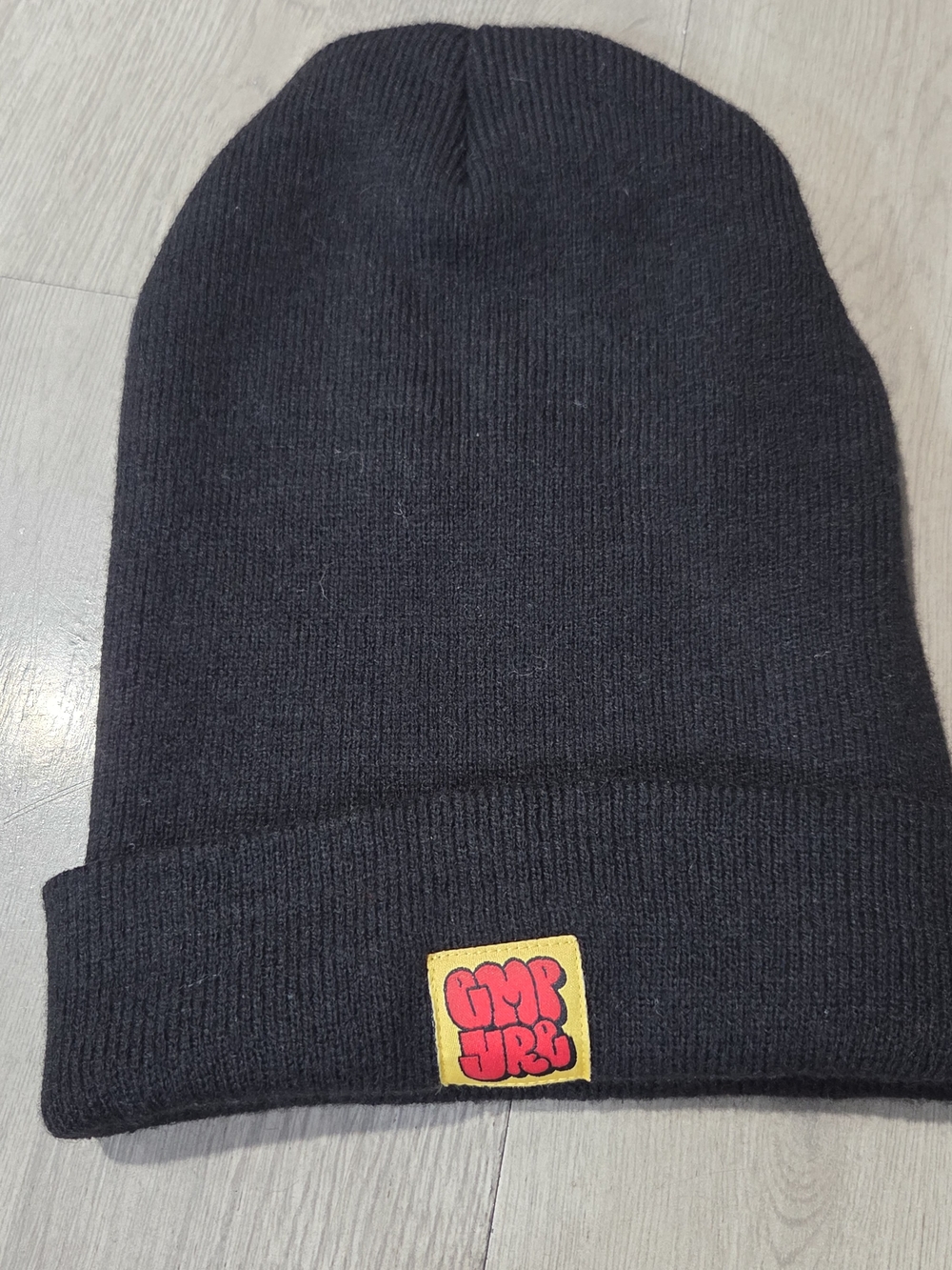 Empyre Black Ribbed Beanie with Yellow & Red Patch